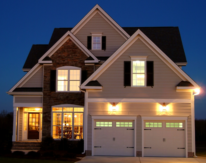 Arriving to a pet sitter client home split level single family home at night with interior and exterior lights on